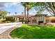 Well-manicured lawn leads up to a lovely home with stone accents and a tile roof at 953 E Fieldstone Pl, Chandler, AZ 85249