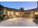 Exterior view of the home showing a three-car garage and desert landscaping at 953 E Fieldstone Pl, Chandler, AZ 85249