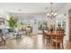 Bright and airy living room and dining room with tile floors, plantation shutters and natural light at 953 E Fieldstone Pl, Chandler, AZ 85249