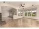 Spacious living room featuring tile floors, neutral paint, fireplace, and great natural light at 953 E Fieldstone Pl, Chandler, AZ 85249