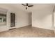 Bright living room featuring tile floors, ceiling fan, and an elegant front door at 953 E Fieldstone Pl, Chandler, AZ 85249