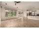 Bright, open living area with tile floor and kitchen in the background at 953 E Fieldstone Pl, Chandler, AZ 85249