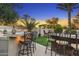 Outdoor bar featuring concrete countertops, stone accents, and bar stool seating, perfect for backyard entertaining at 953 E Fieldstone Pl, Chandler, AZ 85249