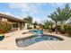 Backyard pool with a jacuzzi and waterfall feature at 953 E Fieldstone Pl, Chandler, AZ 85249