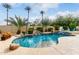 Beautiful backyard pool area with waterfall feature and lush landscaping at 953 E Fieldstone Pl, Chandler, AZ 85249