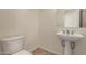 This powder room offers a pedestal sink and a tile floor at 953 E Fieldstone Pl, Chandler, AZ 85249