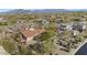 Aerial view of house and surrounding community, showcasing desert landscape and distant mountains at 9740 E Lofty Point Rd, Scottsdale, AZ 85262