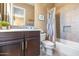 Bathroom with shower/tub combo and dark wood cabinets at 9740 E Lofty Point Rd, Scottsdale, AZ 85262