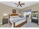 King bedroom with wood furniture and window view at 9740 E Lofty Point Rd, Scottsdale, AZ 85262