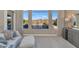 Bedroom with sitting area and beautiful views of the pool and mountains at 9740 E Lofty Point Rd, Scottsdale, AZ 85262