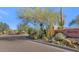 Entrance to the Sierra Norte community, featuring a brick road and desert landscaping at 9740 E Lofty Point Rd, Scottsdale, AZ 85262