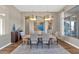 Elegant dining room with a large wooden table and modern light fixtures at 9740 E Lofty Point Rd, Scottsdale, AZ 85262