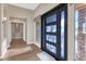 Bright entryway with modern front door and hardwood flooring at 9740 E Lofty Point Rd, Scottsdale, AZ 85262