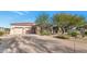 Landscaped front yard and attached three-car garage at 9740 E Lofty Point Rd, Scottsdale, AZ 85262