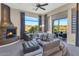 Relaxing living room with a fireplace and access to backyard at 9740 E Lofty Point Rd, Scottsdale, AZ 85262