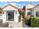 Front entrance with wood door and access to patio at 10522 E Cinnabar Ave, Scottsdale, AZ 85258