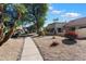 Landscaped pathway leads to the community amenities at 10522 E Cinnabar Ave, Scottsdale, AZ 85258