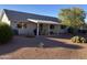Covered patio, gravel yard, and desert landscaping at 10840 E Keats Ave, Mesa, AZ 85209