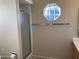 Bathroom with shower, octagon window, and vanity at 10840 E Keats Ave, Mesa, AZ 85209