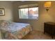 Bright bedroom with a double bed and backyard view at 10840 E Keats Ave, Mesa, AZ 85209