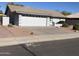 House exterior with a two-car garage and desert landscaping at 10840 E Keats Ave, Mesa, AZ 85209