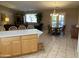 Kitchen features island, ample cabinetry, and tile flooring at 10840 E Keats Ave, Mesa, AZ 85209