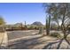 Gated community entrance with mountain views and desert landscaping at 10985 E Buckhorn Dr # 22, Scottsdale, AZ 85262