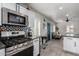 Modern kitchen with stainless steel appliances and gas stove at 1428 E Portland St, Phoenix, AZ 85006