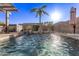 Inviting pool and spa with water features and pergola at 14309 W Cypress St, Goodyear, AZ 85395