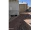 Gravel and brick backyard with potted plants next to the home at 1448 S Zuni --, Apache Junction, AZ 85119