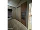 Bedroom with double bed, sliding closet doors, and built-in entertainment center at 1448 S Zuni --, Apache Junction, AZ 85119