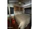 Bedroom with a double bed, ceiling fan, and built-in cabinets and nightstand at 1448 S Zuni --, Apache Junction, AZ 85119