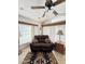 Relaxing living room with a brown leather couch and a ceiling fan at 1448 S Zuni --, Apache Junction, AZ 85119