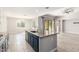 Kitchen island with granite countertop and blue cabinetry at 15208 S 182Nd Ln, Goodyear, AZ 85338