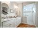 Elegant bathroom with double vanity and walk-in shower at 16541 W Edgemont Ave, Goodyear, AZ 85395