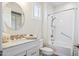 Clean bathroom with a tub, shower, and modern vanity at 16541 W Edgemont Ave, Goodyear, AZ 85395