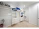 Spacious walk-in closet with ample shelving and drawers at 16541 W Edgemont Ave, Goodyear, AZ 85395