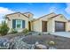 House exterior with two-car garage and landscaping at 16541 W Edgemont Ave, Goodyear, AZ 85395