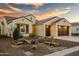 Beautiful stucco home with a 2-car garage and desert landscaping at 16541 W Edgemont Ave, Goodyear, AZ 85395