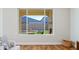 Bright living room with backyard view and fireplace at 16541 W Edgemont Ave, Goodyear, AZ 85395