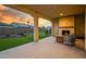 Covered patio features a fireplace and seating area at 16541 W Edgemont Ave, Goodyear, AZ 85395
