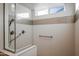 Walk-in shower with modern fixtures and patterned tile at 16541 W Edgemont Ave, Goodyear, AZ 85395