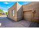 Attached garage with a tan stucco exterior at 18411 E Tranquilo Way, Rio Verde, AZ 85263