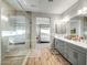 Bathroom with double vanity and large glass shower at 18516 N 65Th Pl, Phoenix, AZ 85054