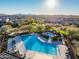 Resort-style community pool with lounge chairs and scenic mountain views at 18516 N 65Th Pl, Phoenix, AZ 85054