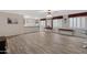 Spacious basement recreation area with wood-look flooring and wet bar at 1971 E Yellowstone Pl, Chandler, AZ 85249