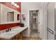 Bathroom with granite countertop, walk-in shower, and spacious closet at 1971 E Yellowstone Pl, Chandler, AZ 85249
