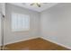 Simple bedroom with wood flooring and window shutters at 1971 E Yellowstone Pl, Chandler, AZ 85249