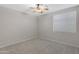 Bright bedroom with neutral walls, carpet flooring, and a ceiling fan at 1971 E Yellowstone Pl, Chandler, AZ 85249
