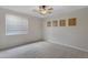 Bedroom with neutral walls, carpet flooring, and a ceiling fan at 1971 E Yellowstone Pl, Chandler, AZ 85249